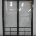 Tall Karaka green aluminium bi-fold door