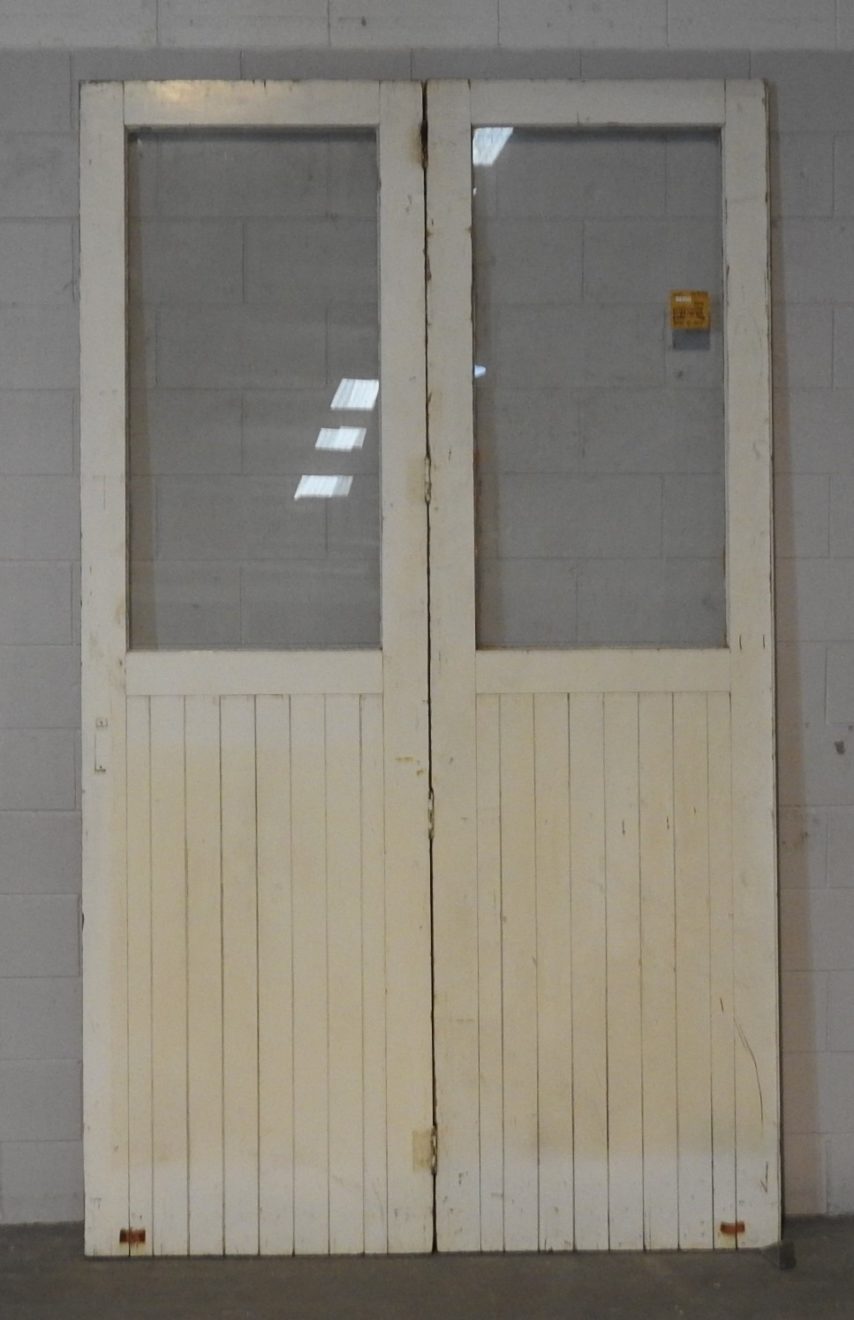 pair of very tall Wooden exterior bifold tg&v doors with glass