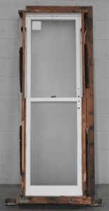 narrow Wooden double-hung window with obscure glass