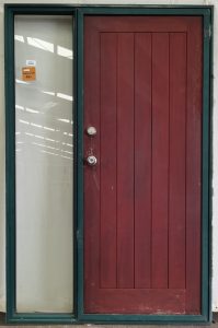 Green aluminium framed cedar door