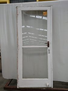 wooden entry door in frame