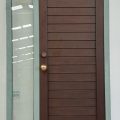 Grey aluminium frame with cedar door and sidelight