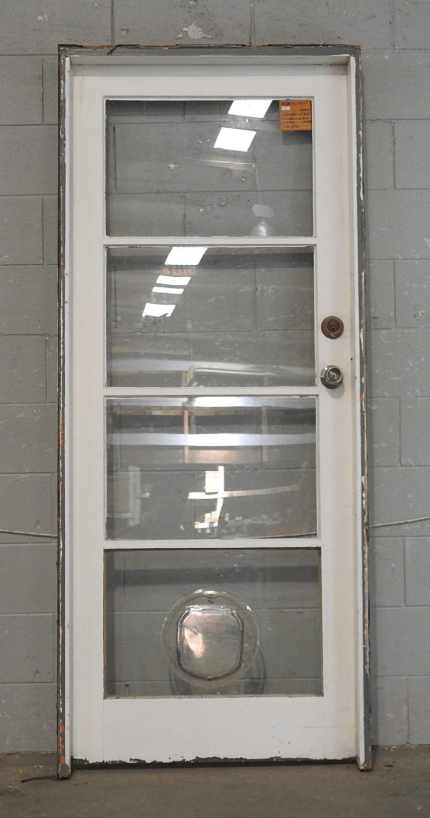 Wooden Exterior 4-Light Door Hung in Frame