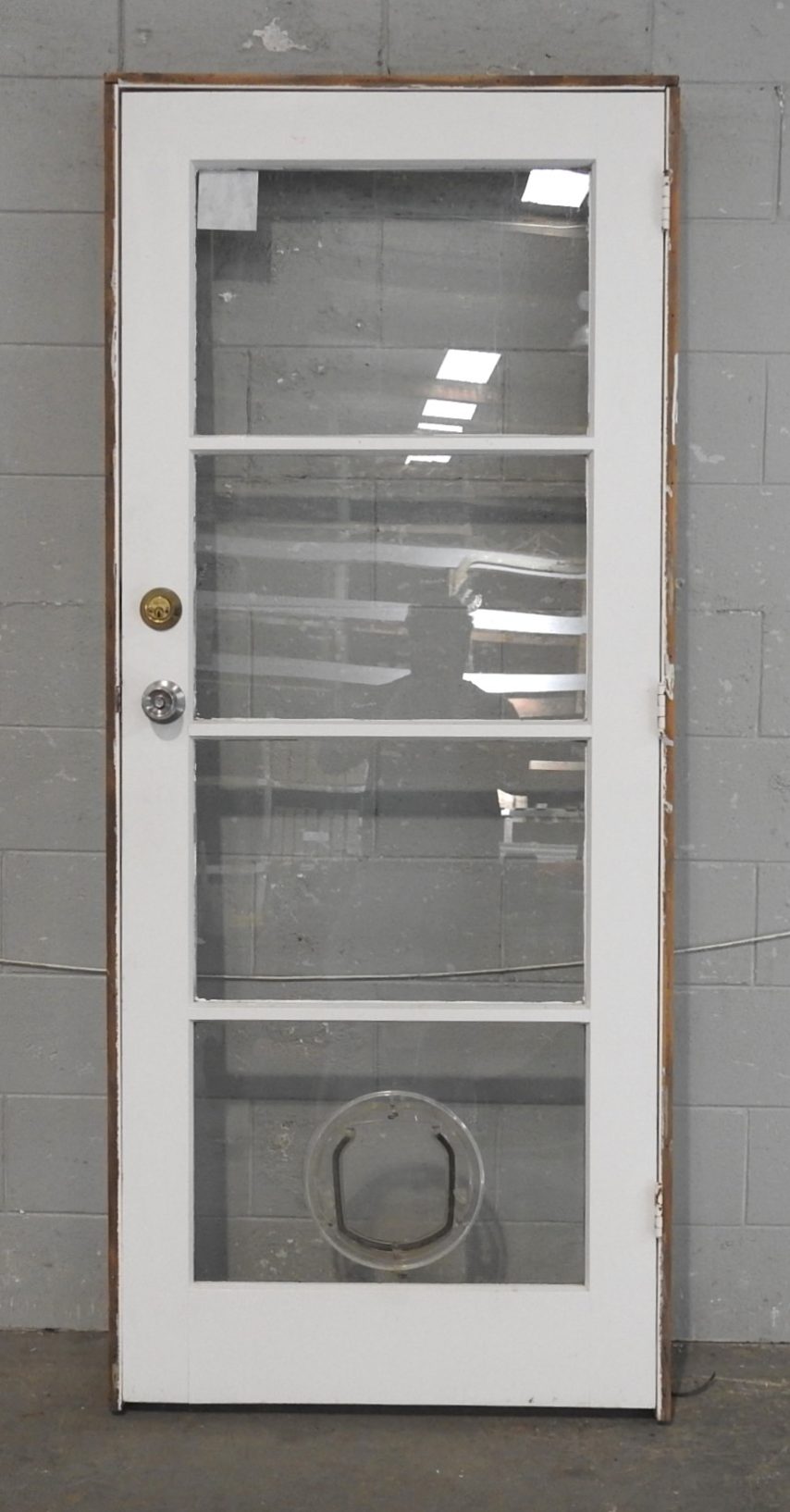 Wooden Exterior 4-Light Door Hung in Frame