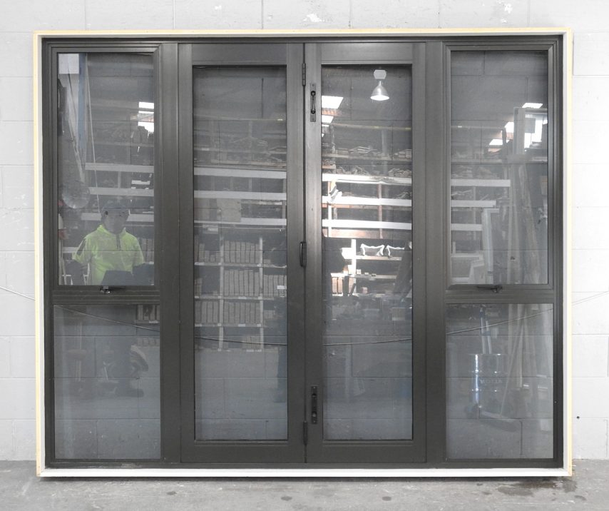 Karaka Green Aluminium Bi-Fold Door With Sidelights