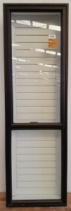 Dark bronze aluminium awning window with Santa F? shutters