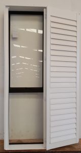Dark bronze aluminium awning window with Santa F? shutters