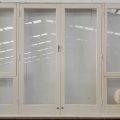 Wooden French doors with sidelights