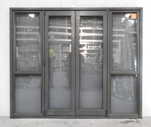 Karaka Green Aluminium Bi-Fold Door With Sidelights