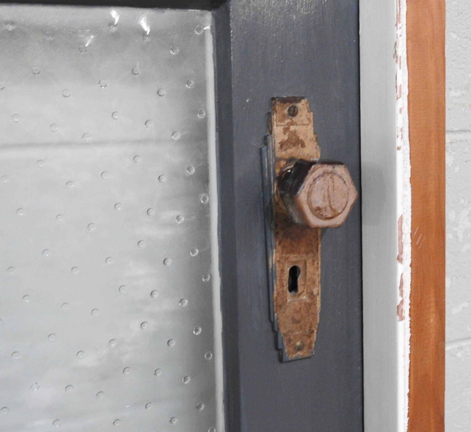 Narrow Wooden Exterior Entry Door Hung In Frame