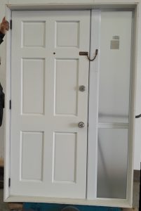 White aluminium entrance door with security door