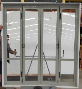 Mint green aluminium four pane bi-fold door
