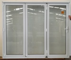 White double glazed bi-fold with dedicated door