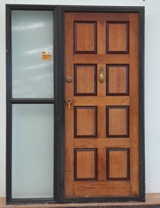 Brown aluminium frame with timber door and sidelight