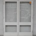 Wooden French 2-Light Doors Hung in Frame