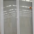 White double glazed aluminum door with shutters