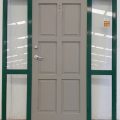 Forest green aluminium frame and Cedar door