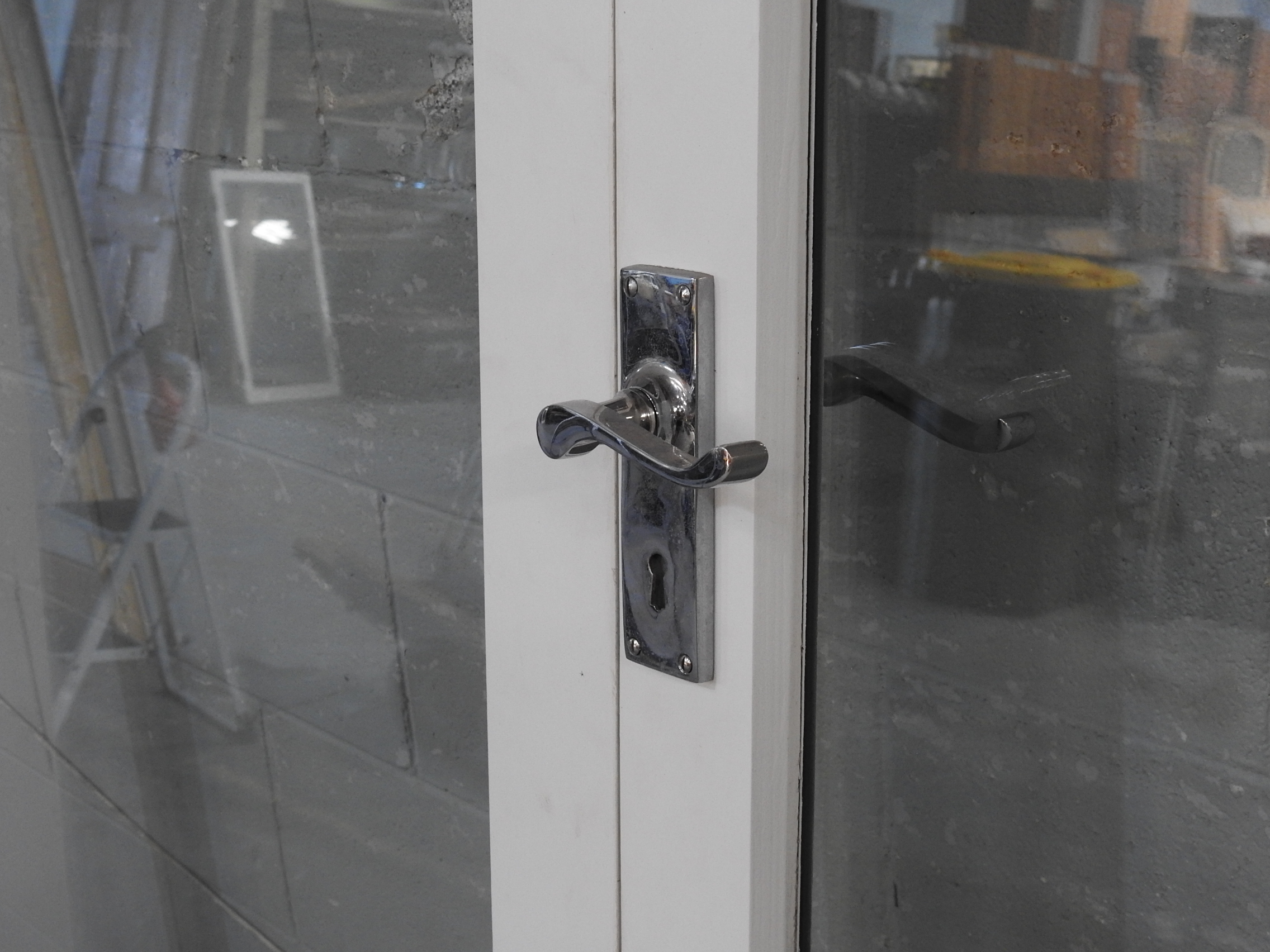 Wooden French Doors Hung In Frame