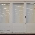 Wooden bi-fold door with dedicated door