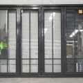 Karaka Green Aluminium Bi-Fold Doors - Laminated Safety Glass
