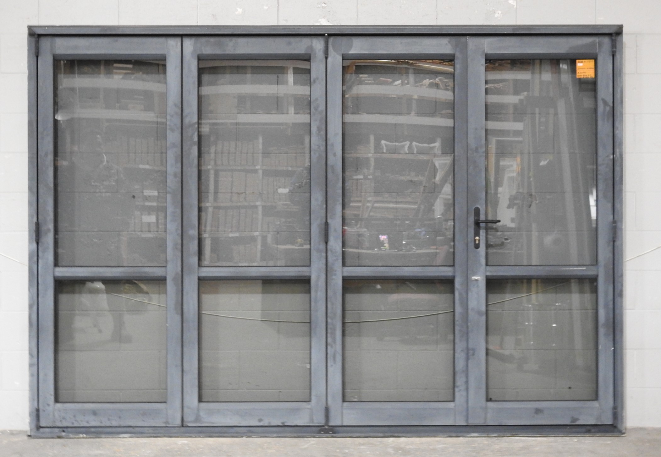 Denim Blue Aluminium Bi-Fold Door With Dedicated Door