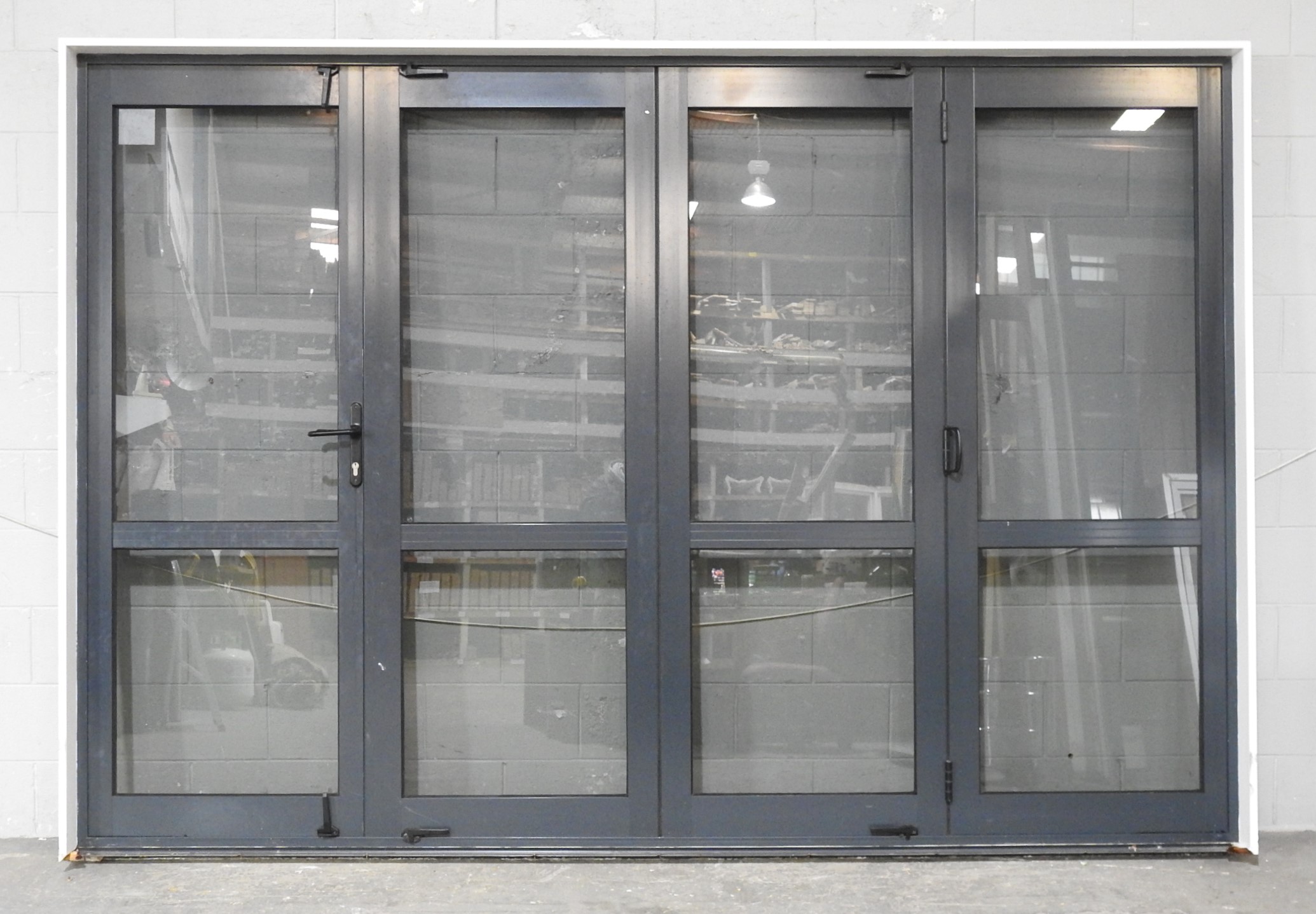 Denim Blue Aluminium Bi-Fold Door With Dedicated Door