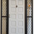 Dark bronze aluminium frame with Rimu door