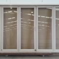 Bronco aluminium bi-fold door with dedicated door