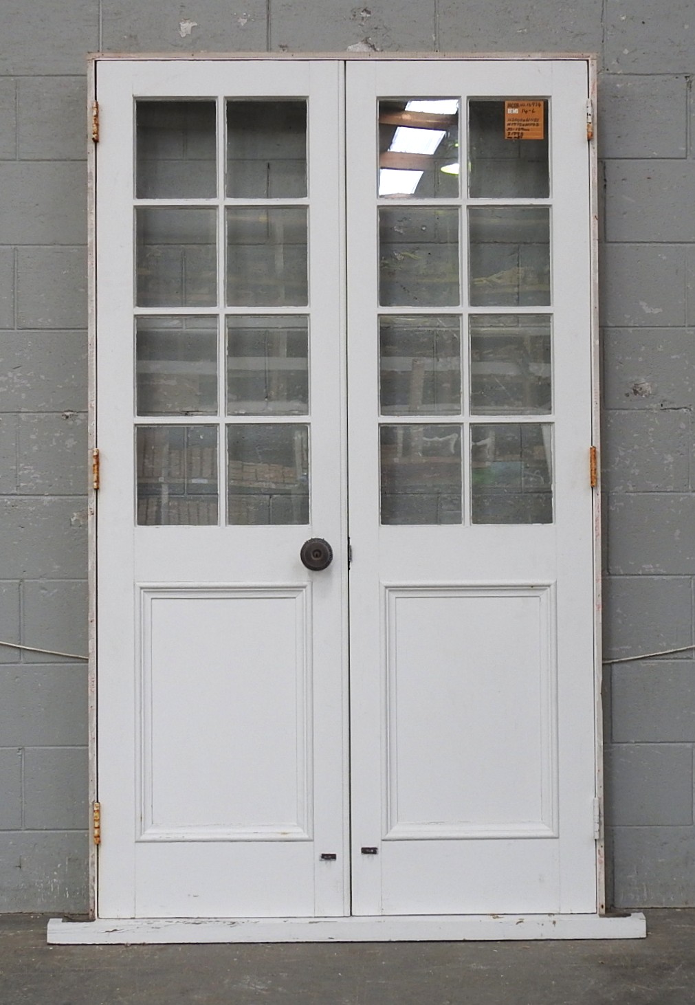 Bungalow Style Wooden French Doors Hung in Frame