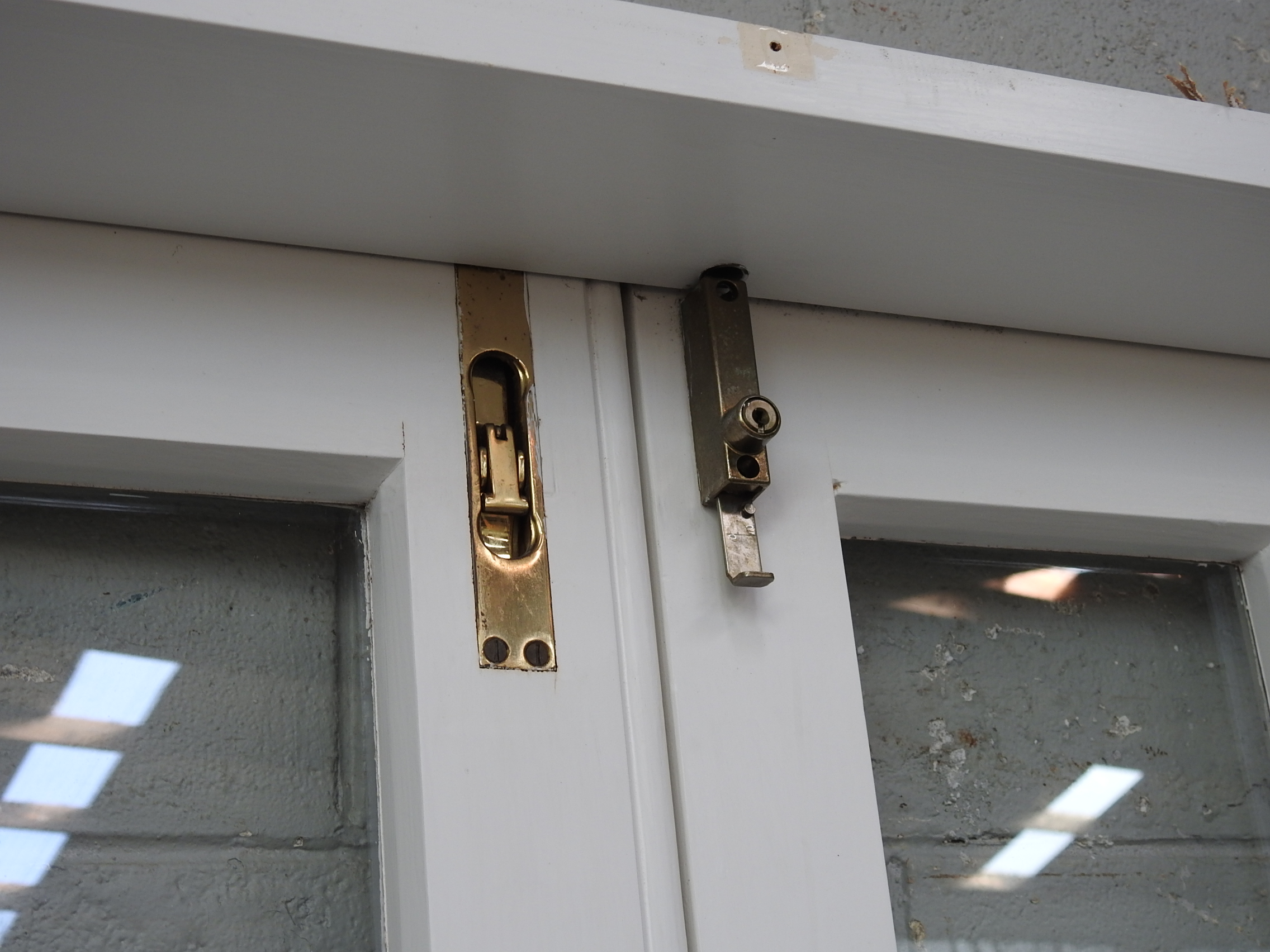 Bungalow Style Wooden French Doors Hung in Frame