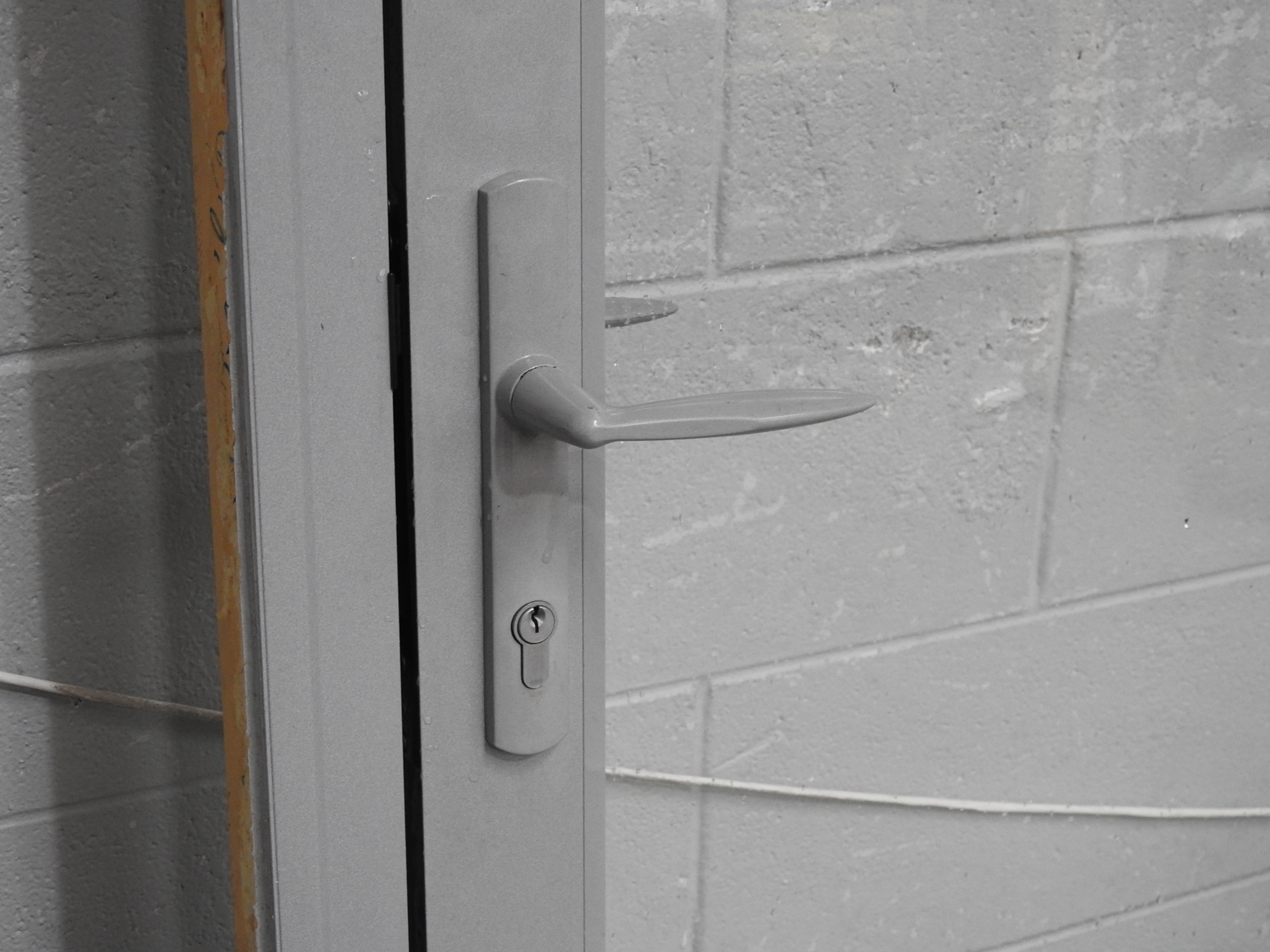 Silver Pearl Aluminium Bi-Fold Doors With Dedicated Door