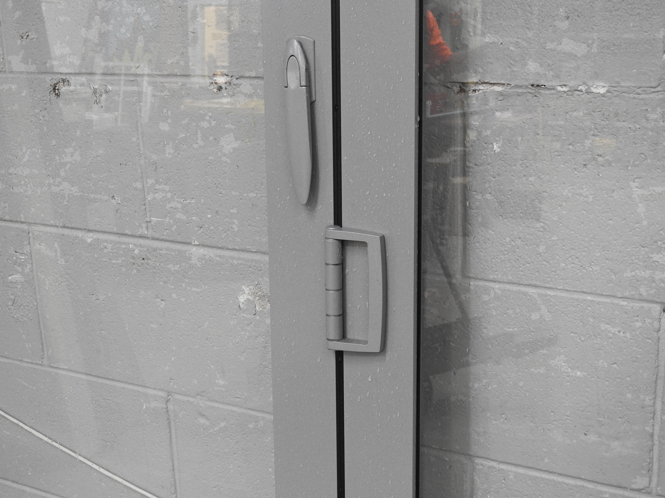 Silver Pearl Aluminium Bi-Fold Doors With Dedicated Door