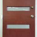 Wooden hardwood entrance door with glass